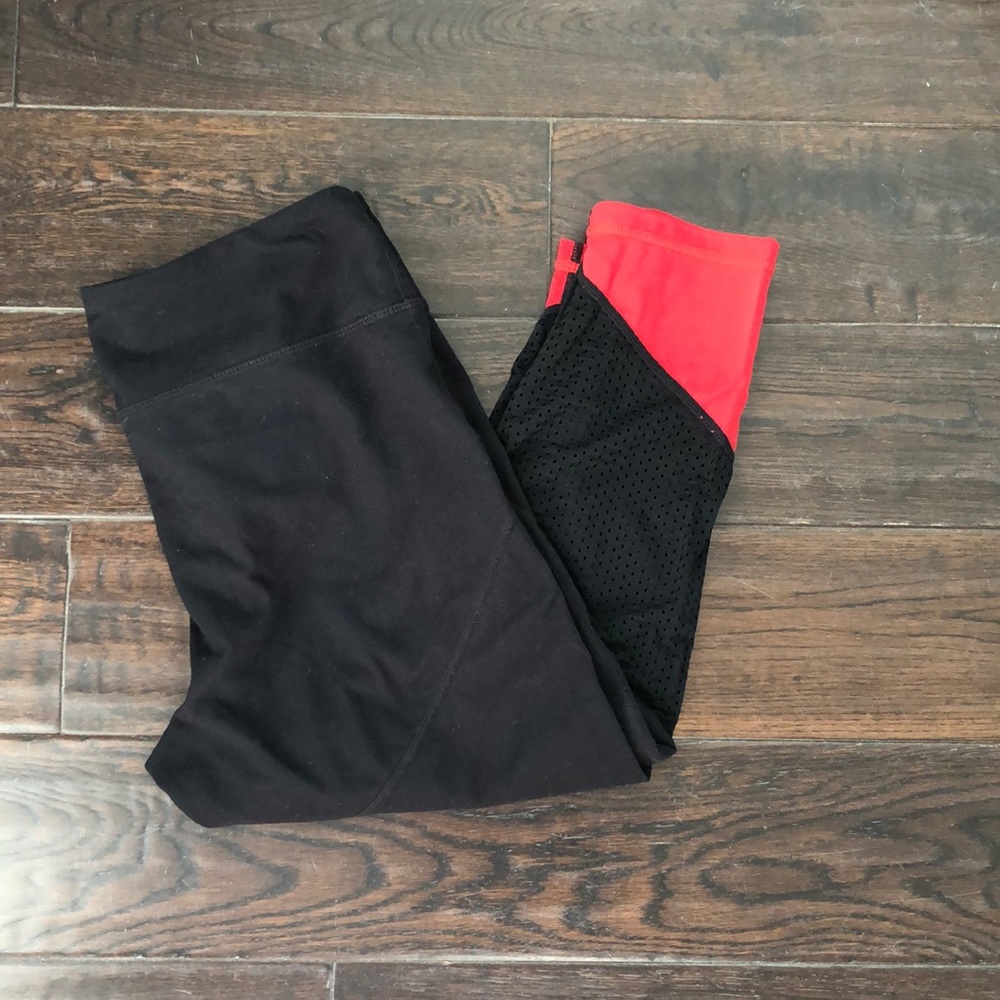 Zella cropped red and black workout pants.
